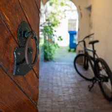 An opened door leading into a hallway at the PThU building in Utrecht, the Netherlands